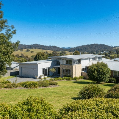 Modern residential house in a suburban Tasmanian neighborhood with green landscape