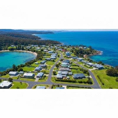 Aerial view of a quiet Tasmanian coastal suburb with green spaces and blue water